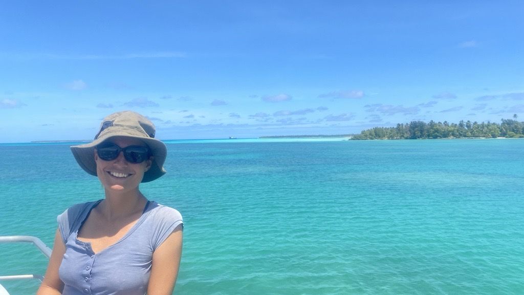 Kristina Koenig smiling on a boat by the Reef.