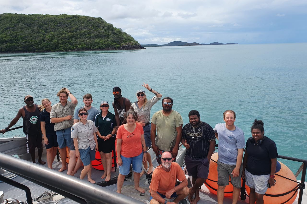 A group shot showing the team of researchers, rangers and TOs at Raine Island.