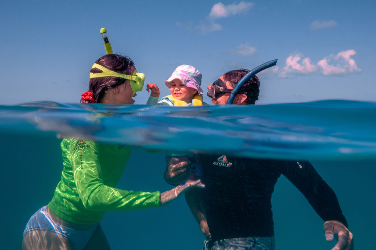 A family snorkelling experience on the Great Barrier Reef. Credit: Tourism and Events Queensland.