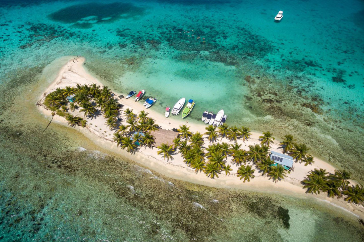 Tourism vessels at Laughing Bird Caye, Belize. Credit: Benedict Kim.