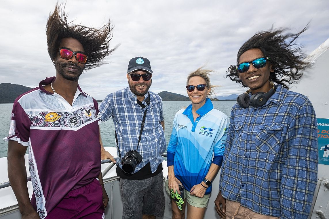 Jamabla Yeatman, Matt Curnock, Katie Chartrand and Alfred Gray en route to visit Moore Reef in Gunggandji sea country. Credit: Julia Sumerling 