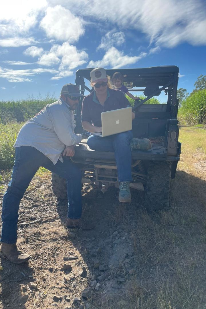 Ellie and Matt Boyd look at farm maps and a soil sampling plan in the field. Credit LiquaForce