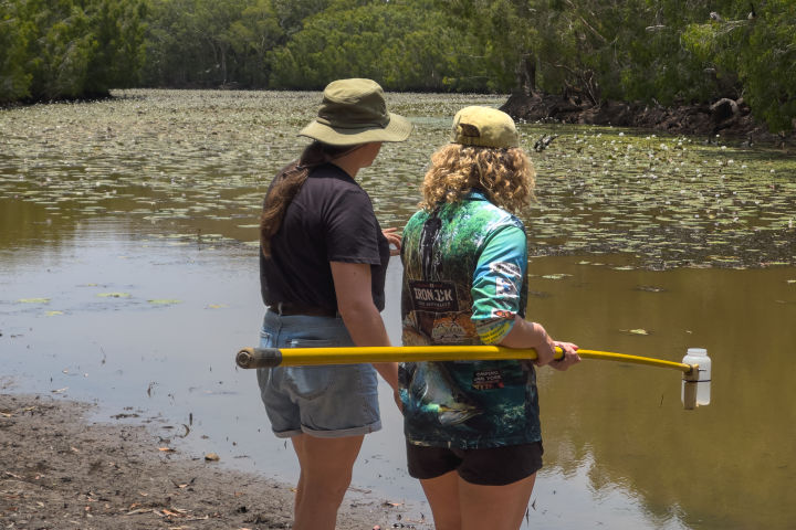 Jessie and Sienna collect samples for water quality testing. Credit: Ben and Di