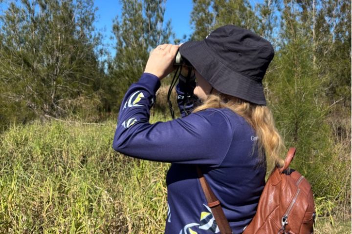 Julia Routh birdwatching in Sunshine Coast wetlands.