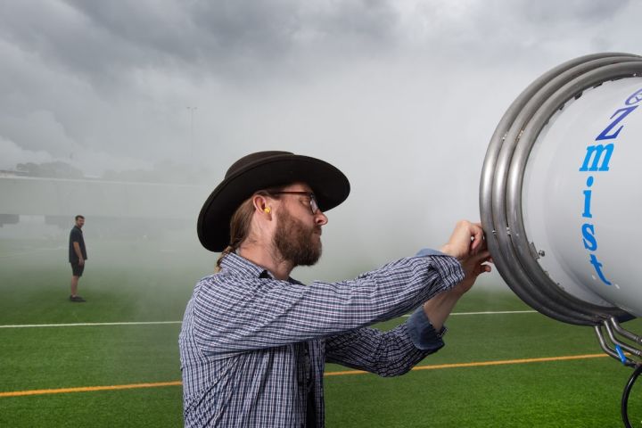 Researchers testing misting cannons on land before on-reef trials. Credit: QUT