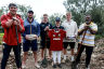 Lions and Wallabies players planting trees on Lady Elliot Island.